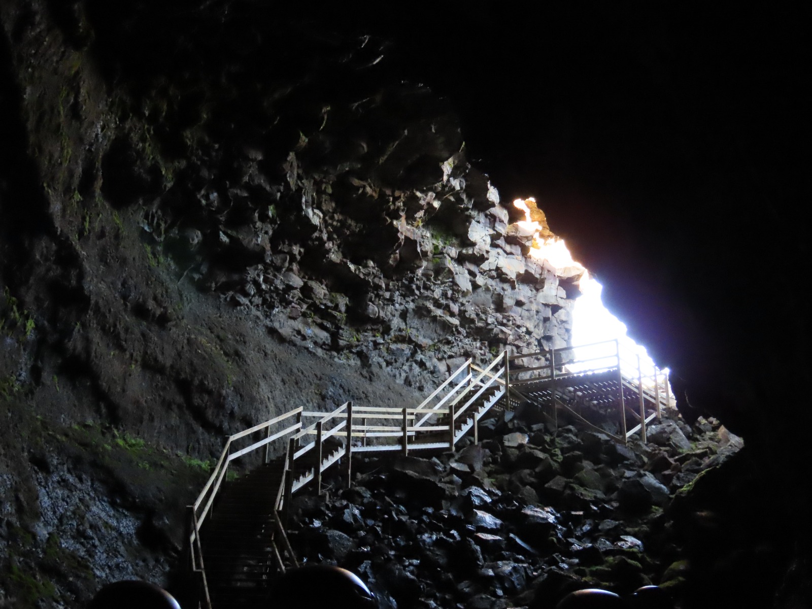 view from inside the cave looking at the stairs going up out of the cave